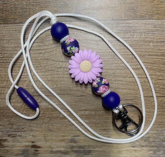 Navy blue and floral daisy lanyard with breakaway clasps